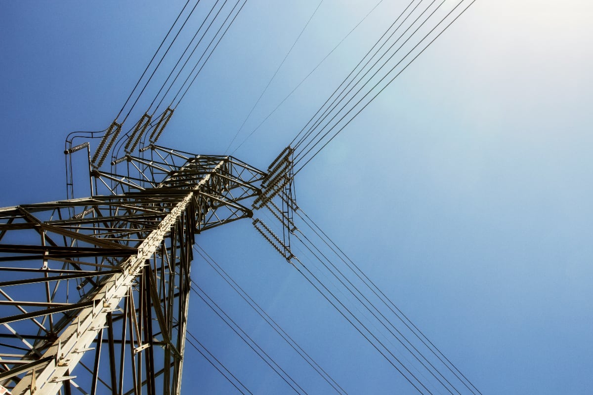 Looking up at powerlines and a bluesky